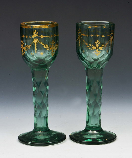 Appraisal: A PAIR OF ANTIQUE GREEN GLASS LIQUEUR GLASSES with seven