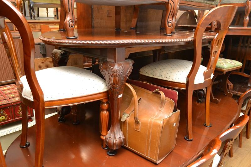 Appraisal: A CHIPPENDALE DINING TABLE WITH TWO SPARE LEAVES AND CRANK