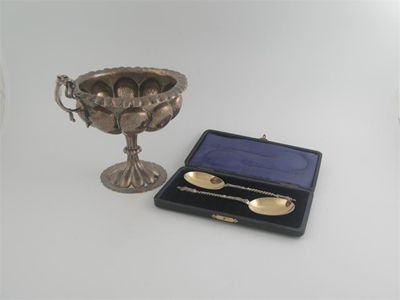 Appraisal: An Edwardian two handled pedestal cup with lobed and textured