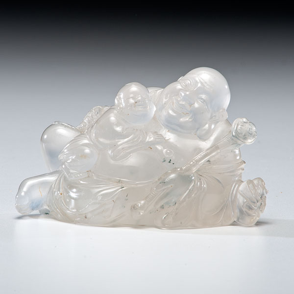 Appraisal: Chinese A colorless quartz figural group with a seated laughing