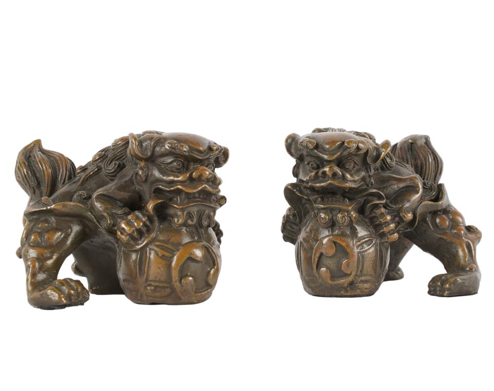 Appraisal: PAIR OF CHINESE BRONZE SCROLL WEIGHTSmodeled as foo dogs inches