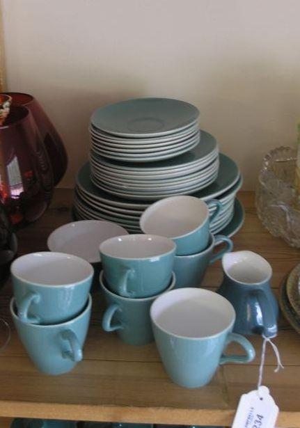 Appraisal: A Poole Pottery breakfast service thirty-four pieces green monochrome