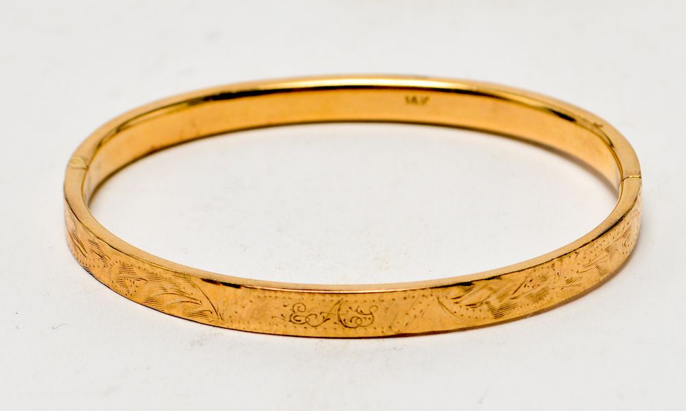 Appraisal: K Yellow Gold Engraved Hinged Bangle Bracelet K yellow gold