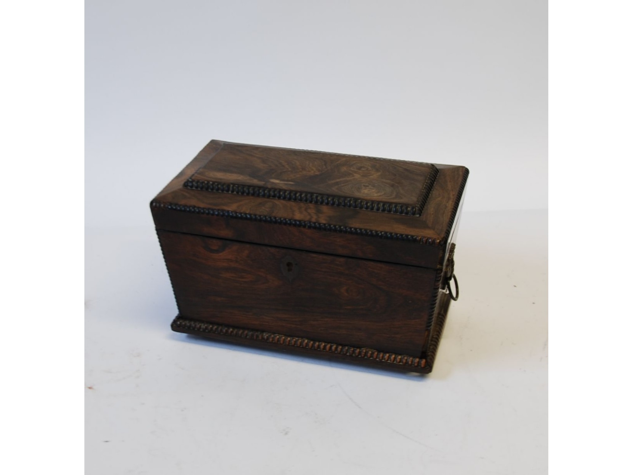 Appraisal: A VICTORIAN EBONY SARCOPHAGUS SHAPED TEA CADDY with beaded borders