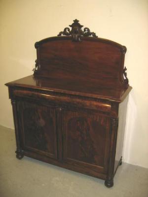 Appraisal: A VICTORIAN MAHOGANY CHIFFONIER of inverted breakfront form the arched