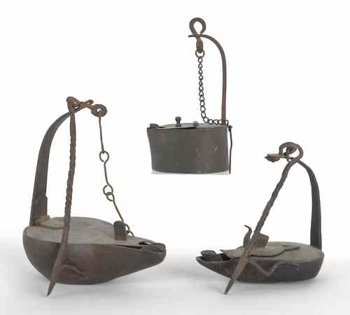 Appraisal: Three iron Betty lamps th th c one with spurious