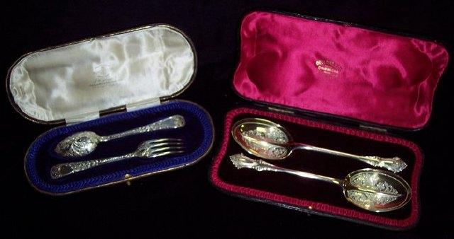 Appraisal: A cased Christening spoon and fork with scroll and foliate