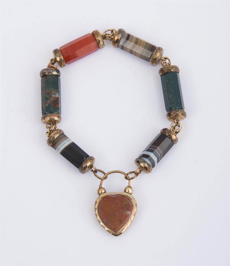 Appraisal: GILT-METAL AND HARDSTONE BRACELET With barrel-shaped links of multi-colored hardstone