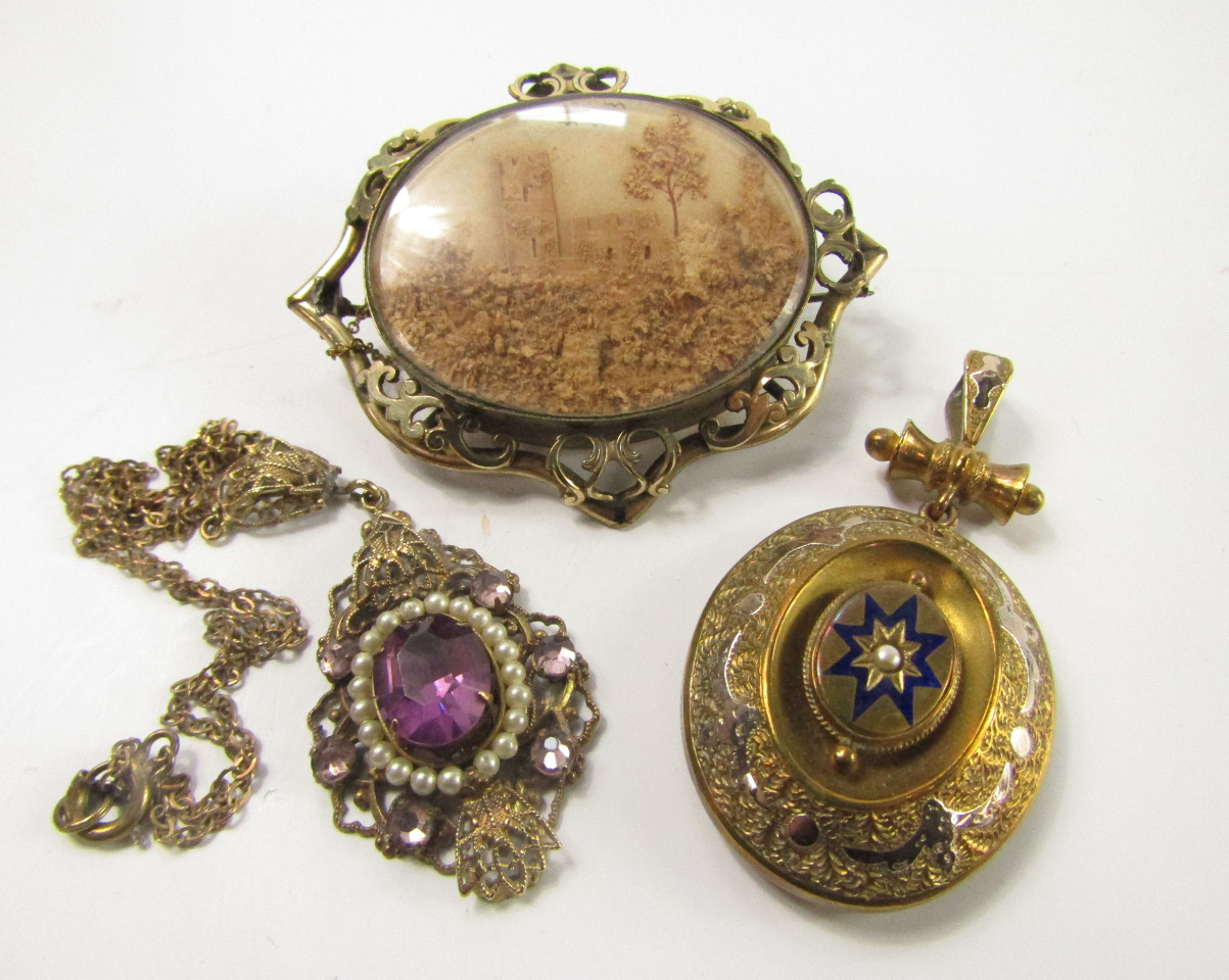 Appraisal: A Victorian oval cork brooch carved with a castle in