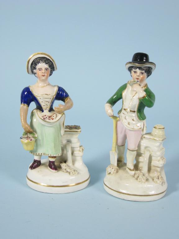 Appraisal: Pair of Staffordshire Figures of gardeners with painted details on