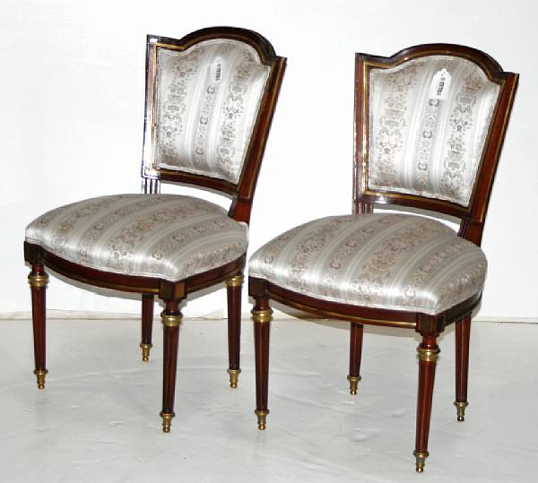 Appraisal: A pair of Louis XVI style gilt bronze mounted mahogany