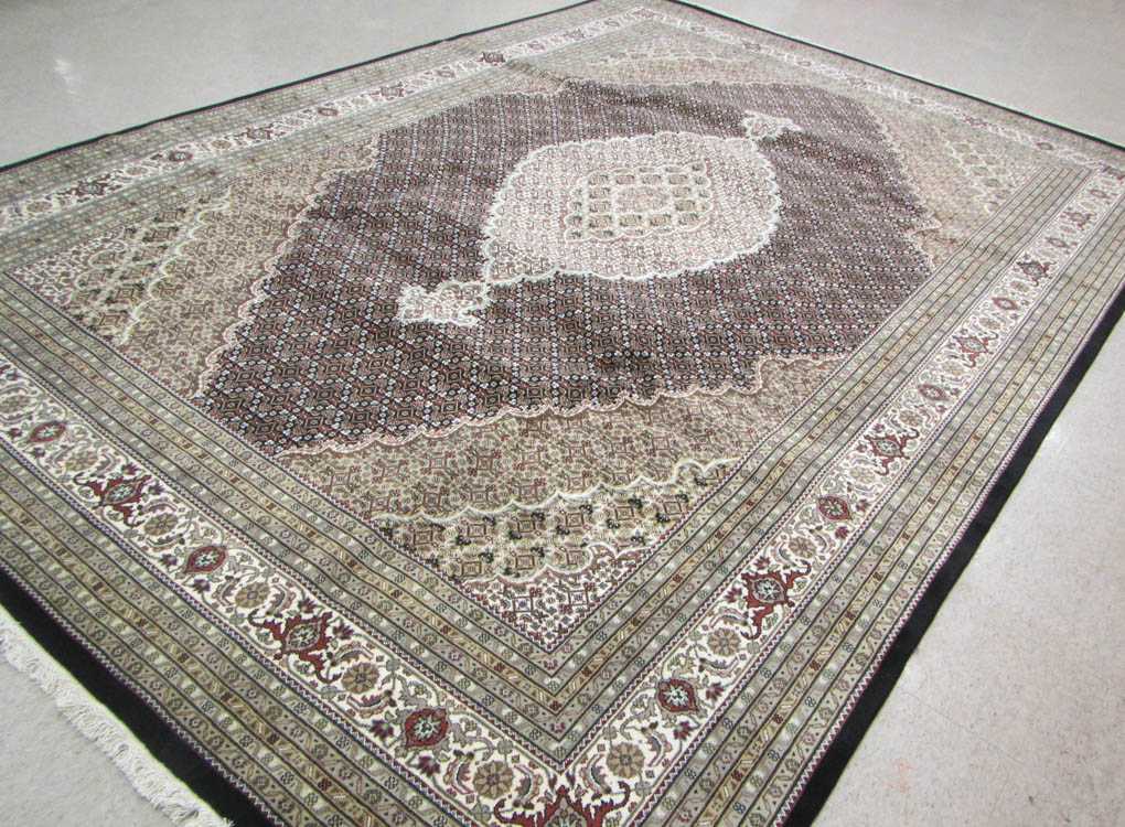 Appraisal: HAND KNOTTED ORIENTAL CARPET Persian Bijar design central medallion and