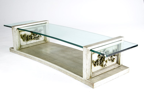 Appraisal: JAMES MONT Silver-painted coffee table with curved glass insert top