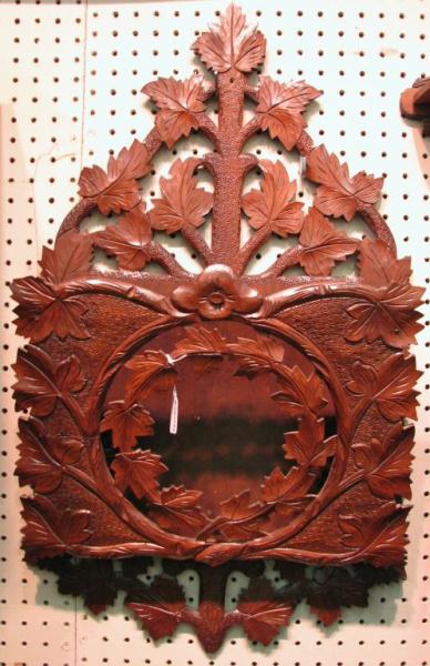 Appraisal: Victorian walnut periodicals wall rack with carved reticulated leaf design