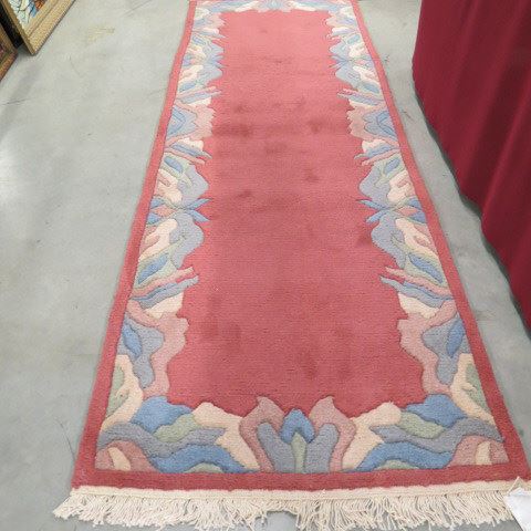 Appraisal: Chinese Handmade Sculptured Runner salmon with fancy border ' x