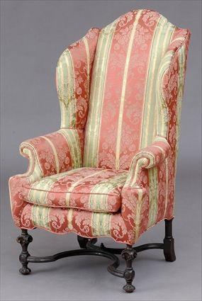 Appraisal: WILLIAM AND MARY CARVED WALNUT WING ARMCHAIR With serpentine top