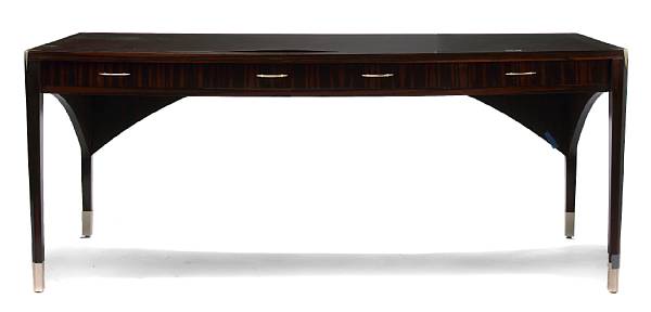 Appraisal: An Art Deco style macassar ebony and silvered-metal desk with