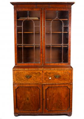 Appraisal: An early th Century mahogany bookcase enclosed by a pair