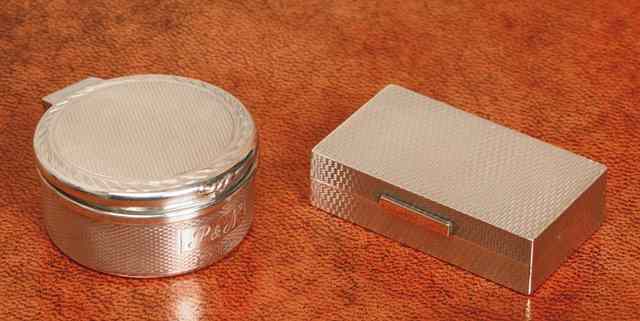 Appraisal: A SILVER PILL BOX rectangular shaped with engine turned decoration