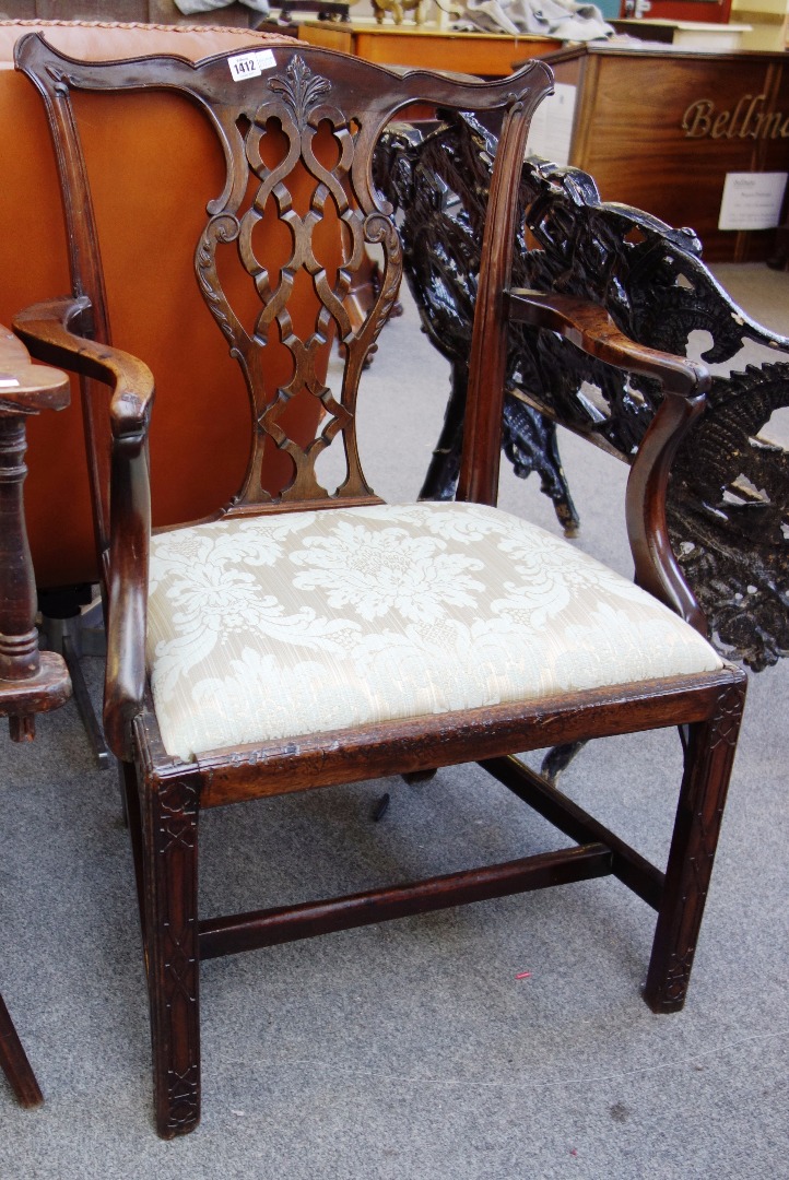 Appraisal: A George III mahogany carver chair with pierced splat on