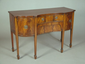 Appraisal: A George III style mahogany serpentine sideboard mid th century