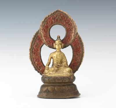 Appraisal: A Gilt Bronze Buddha Shakyamuni Seated in lotus position on