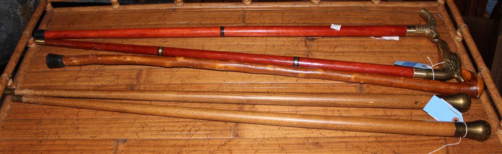 Appraisal: SEVEN WALKING STICKS including brass capped one with an eagle's