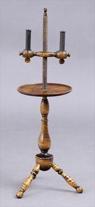 Appraisal: AMERICAN FIGURED MAPLE TRIPOD CANDLE STAND The vase stem with