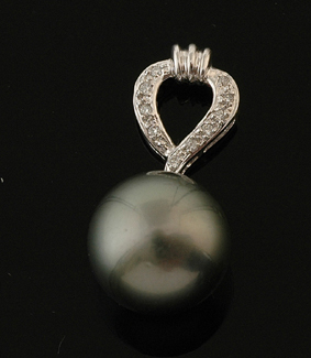 Appraisal: A Tahitian pearl and diamond pendant The Tahitian pearl of