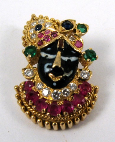 Appraisal: RUBY SAPPHIRE AND EMERALD PENDANT k yellow gold The pendant