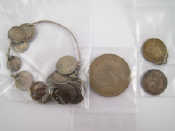 Appraisal: A mixed lot comprising a coin bracelet two coins and