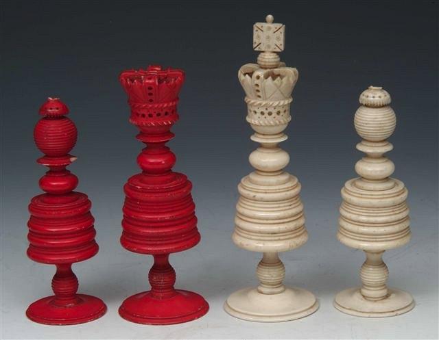 Appraisal: A TURNED IVORY CHESS SET the King with carved crown