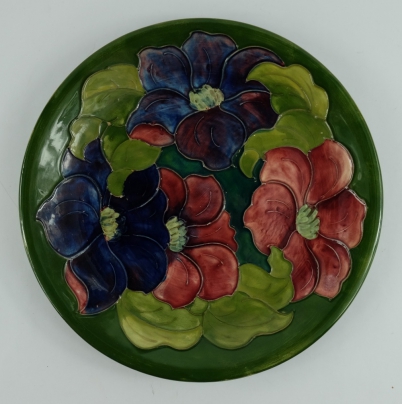 Appraisal: Moorcroft charger decorated in the Anemone design on green signed