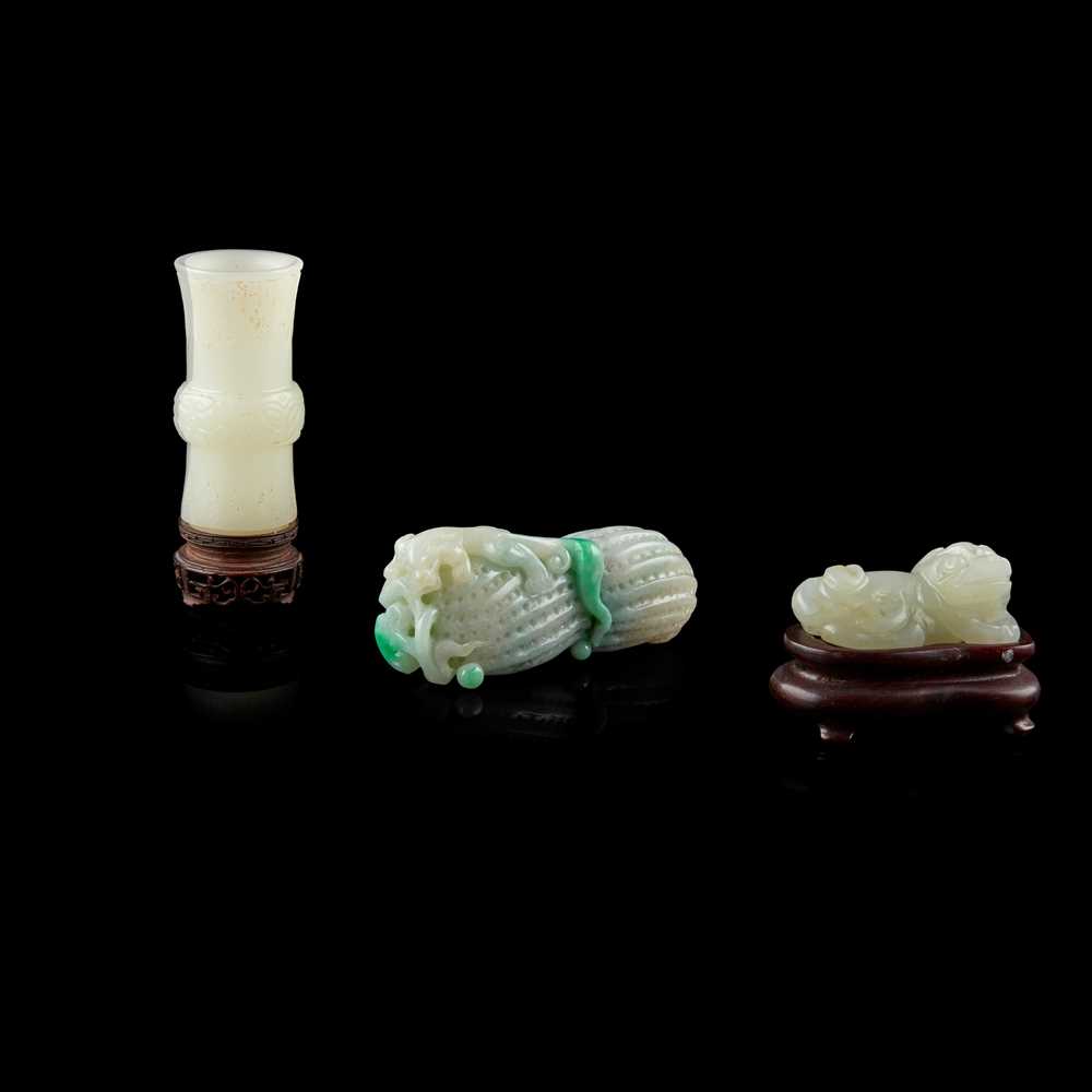 Appraisal: GROUP OF THREE JADE CARVINGS comprising a white jade gu-form