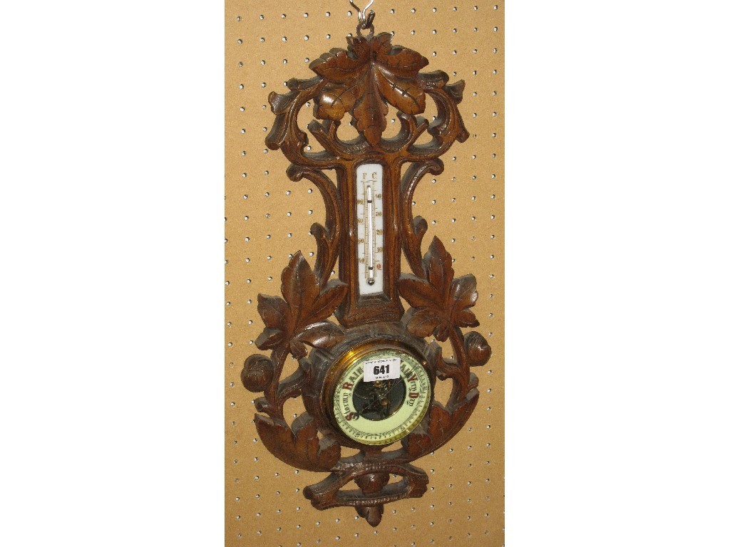 Appraisal: Carved walnut cased barometer