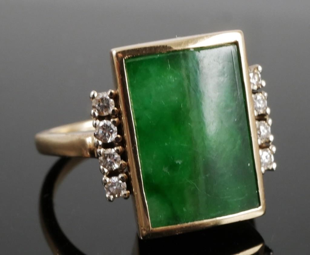 Appraisal: The ring features a jadeite jade raised tablet measuring x