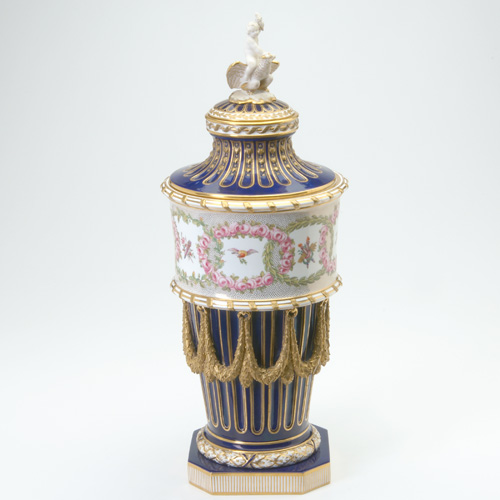 Appraisal: STYLE OF SEVRES Tall urn with cover hand-painted with wreaths