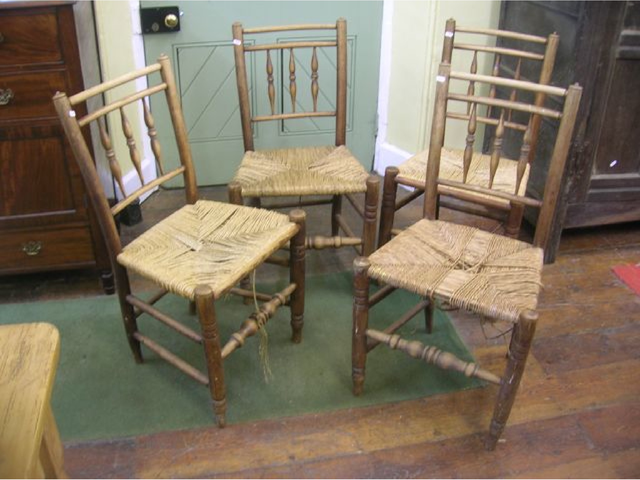 Appraisal: A set of four th century ashwood cottage dining chairs