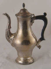 Appraisal: A silver coffee pot in Georgian style with gadrooned rims