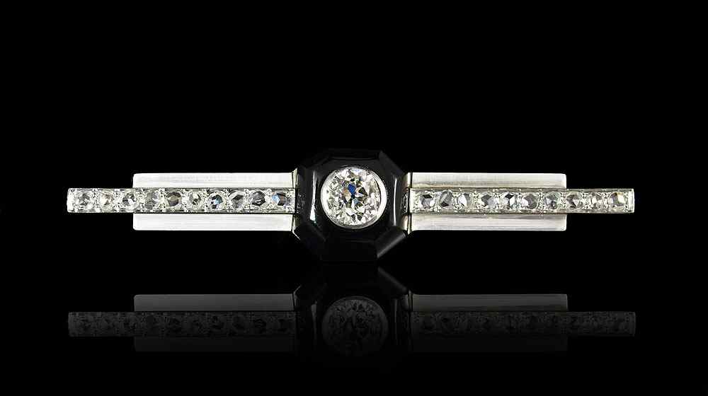 Appraisal: ART DECO PLATINUM DIAMOND ONYX PIN Platinum Art Deco diamond