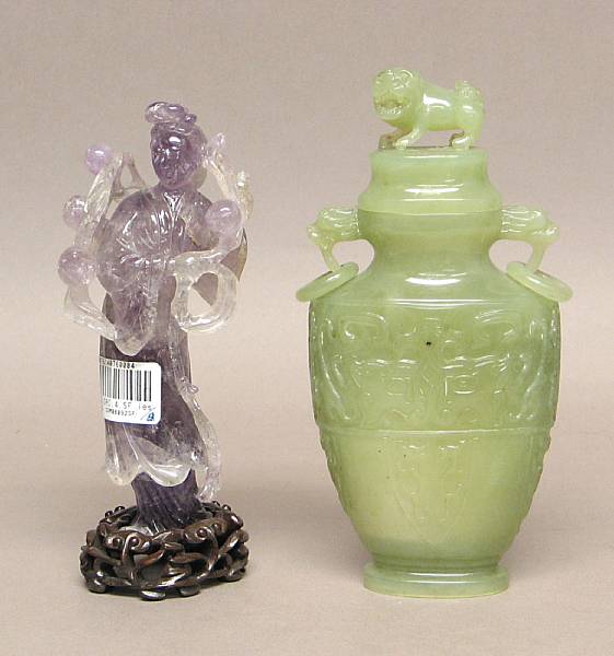 Appraisal: Two carved hardstone decorations One an olive green serpentine covered