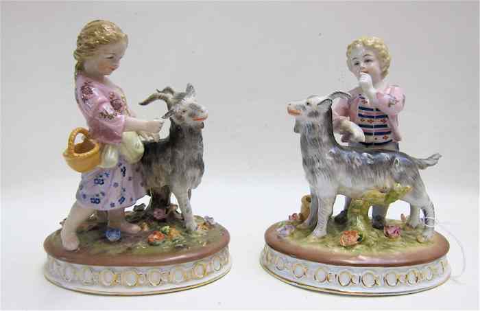 Appraisal: PAIR PORCELAIN FIGURINES boy and girl each with a goat