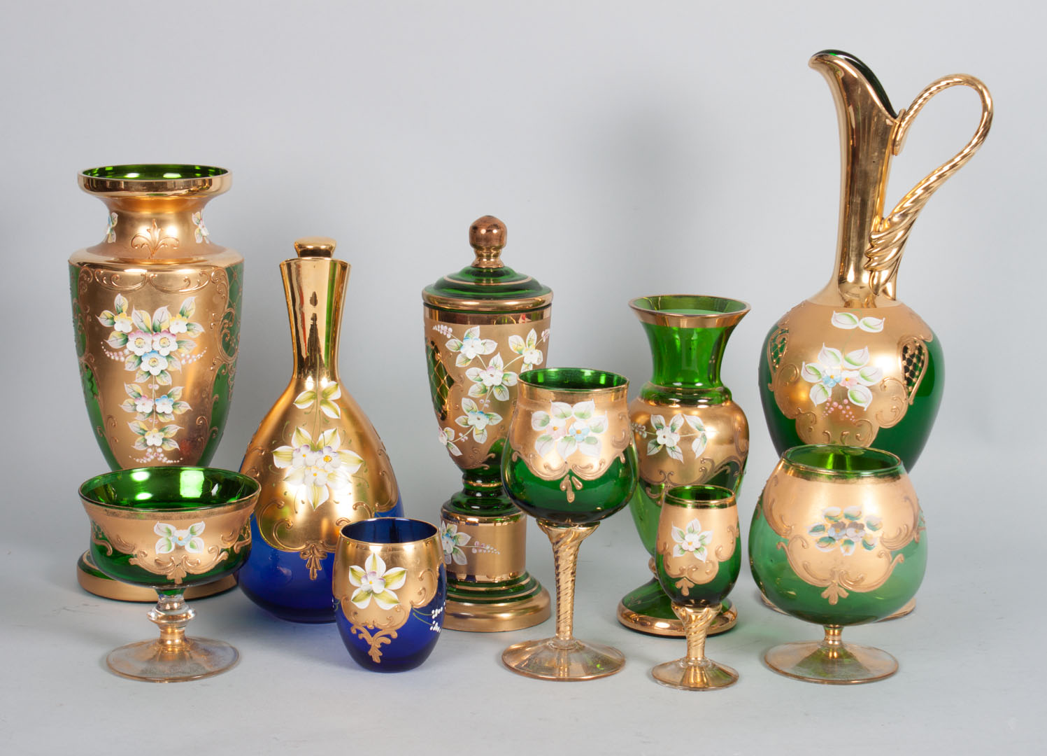 Appraisal: Bohemian colored glass partial stemware service all with gilt and