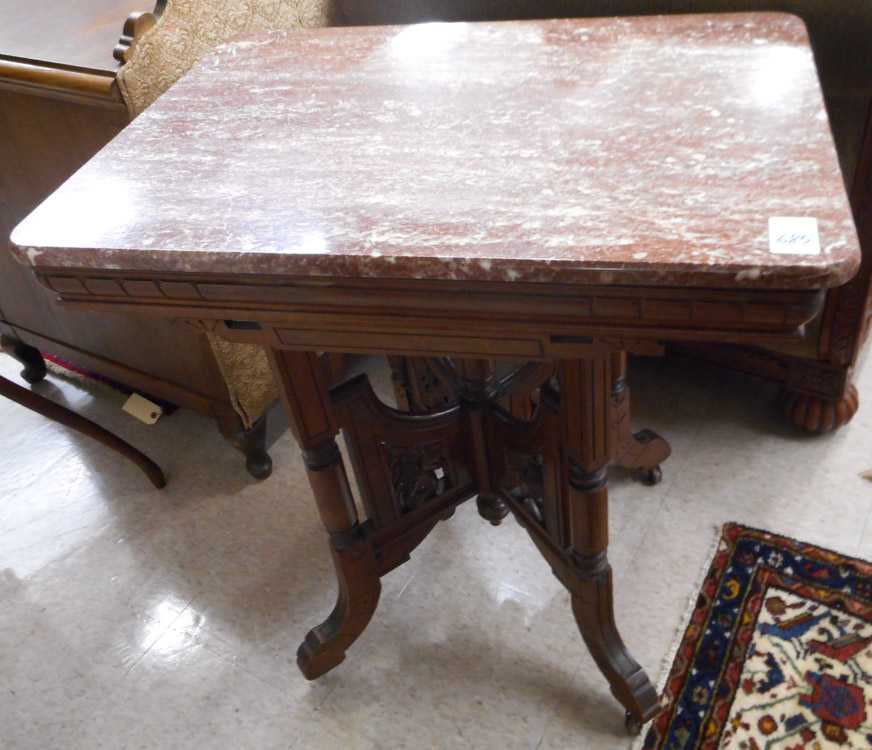 Appraisal: VICTORIAN MARBLE-TOP WALNUT LAMP TABLE Eastlake design American c having