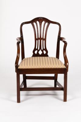 Appraisal: A mahogany armchair with pierced upright splat and swept back