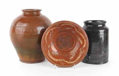 Appraisal: Two pieces of Pennsylvania redware th c together with an