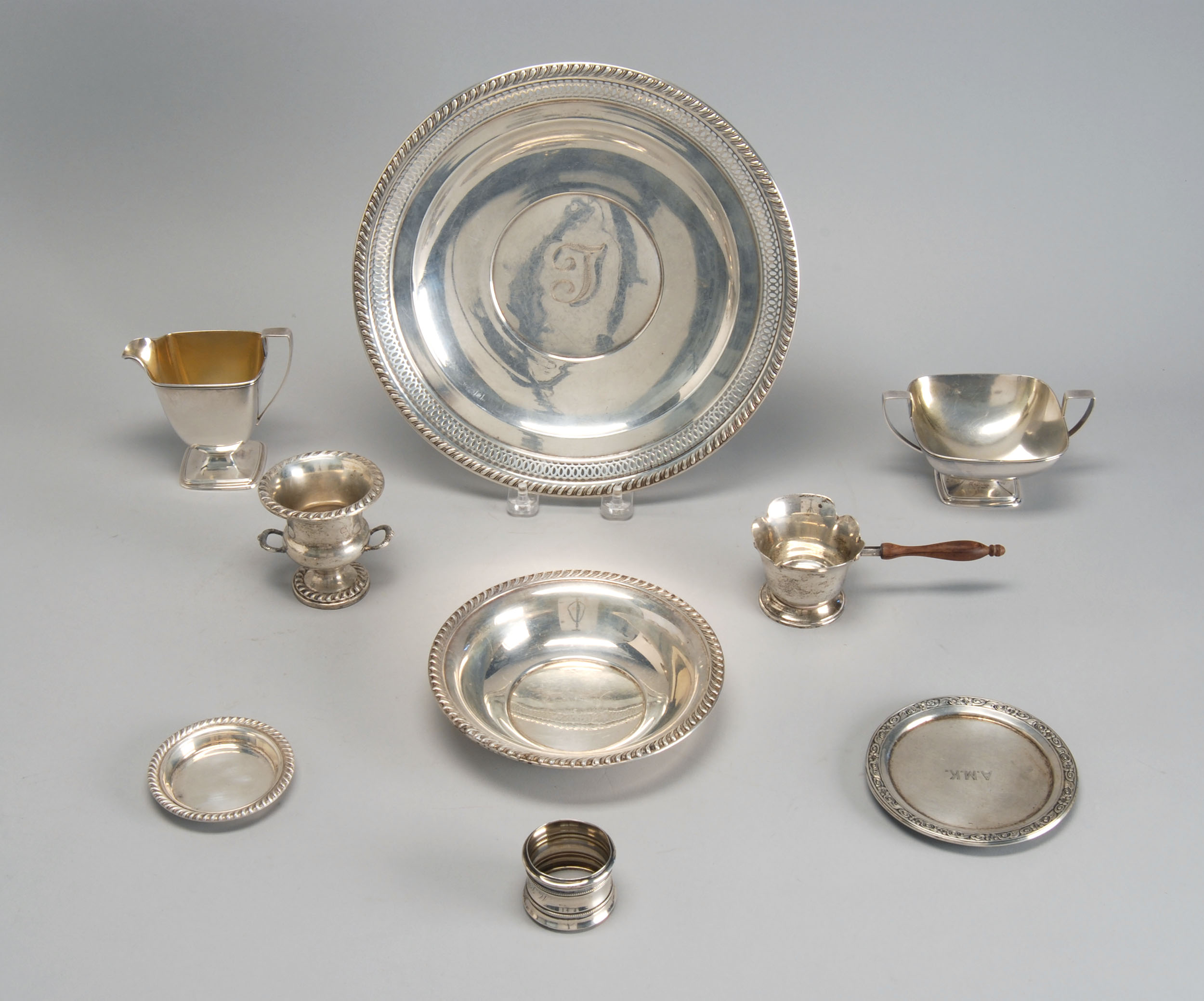 Appraisal: NINE STERLING SILVER HOLLOWWARE PIECES By various makers Includes a