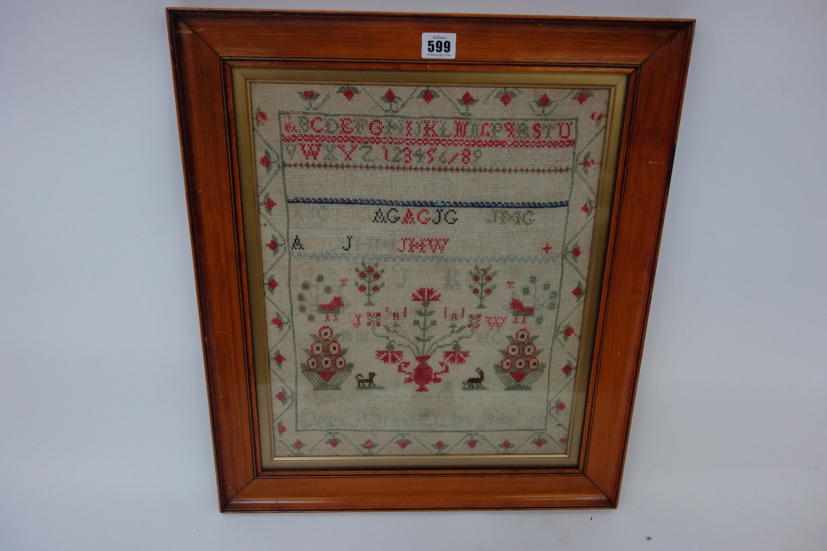 Appraisal: A Victorian needlework sampler worked with alphabets and numerals trees