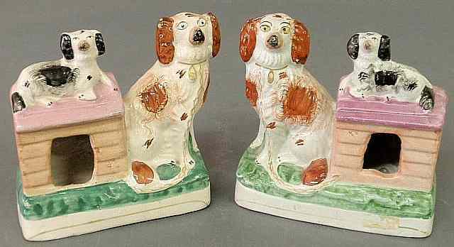 Appraisal: Pair of th c Staffordshire figural groups with red and