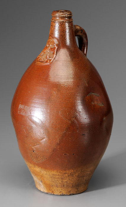 Appraisal: Stoneware Bellarmine Jug German th century molded mask at neck